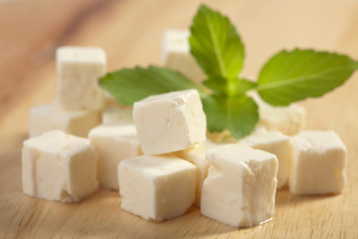 feta cheese on wooden cutting board