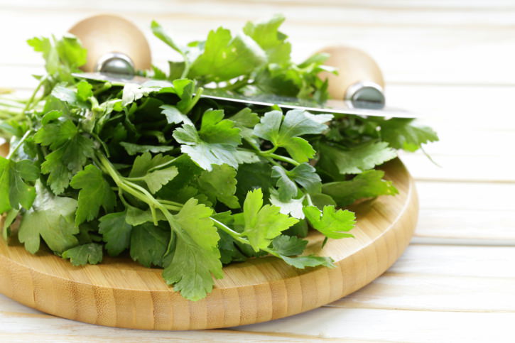 Fresh fragrant green parsley on a cutting board