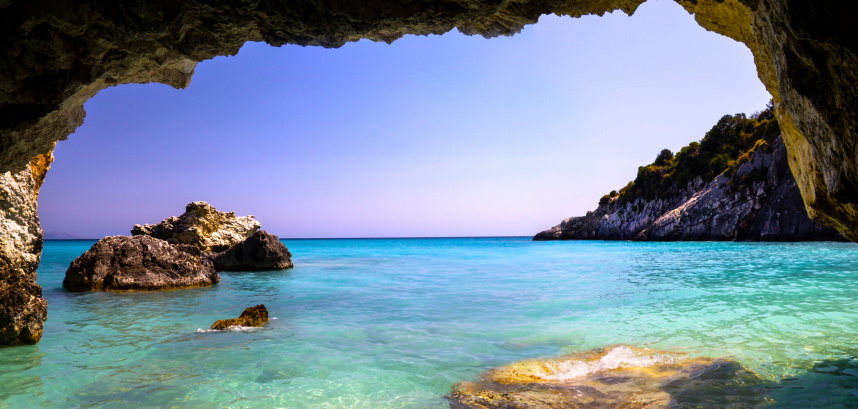 Panoramic cave framing turquoise sea