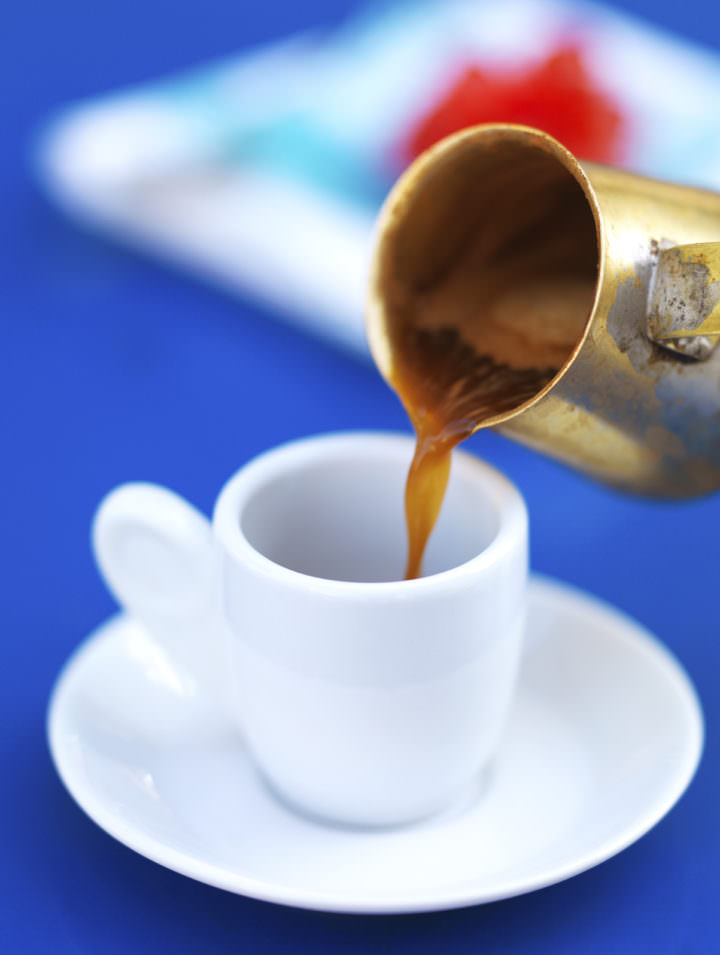 serving greek coffee on a bright blue table