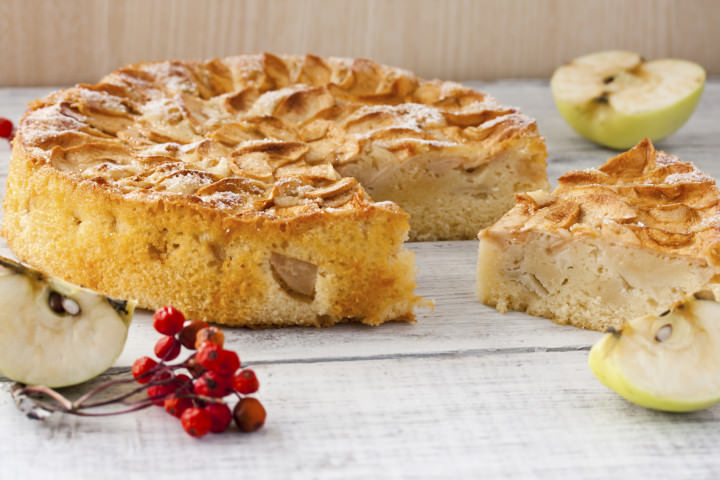 autumn Apple pie with powdered sugar on white background