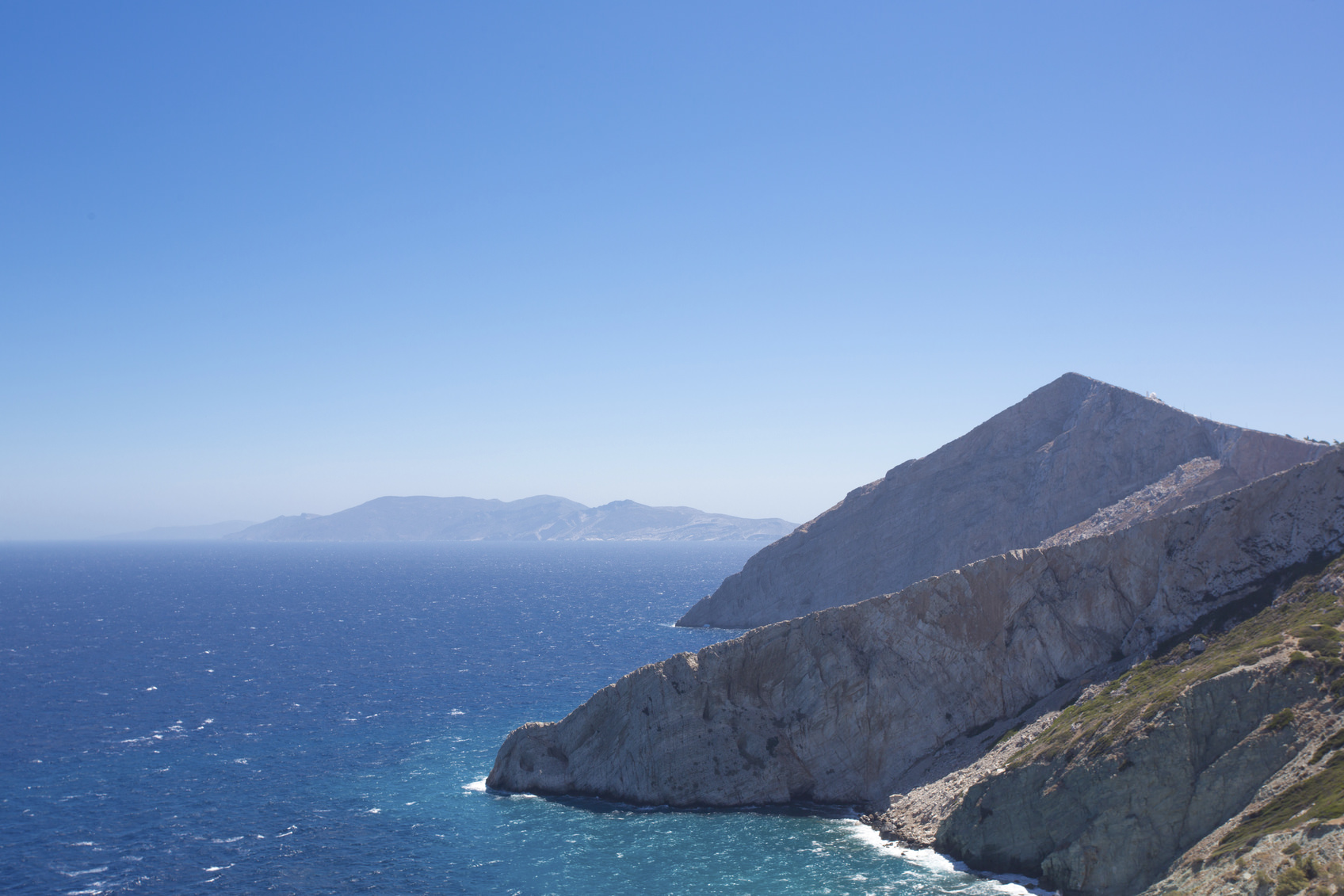 Beautiful view of the shoreline, the Aegean sea and the rocky mountains of Folegandros, an amazing island from Greece 2013.