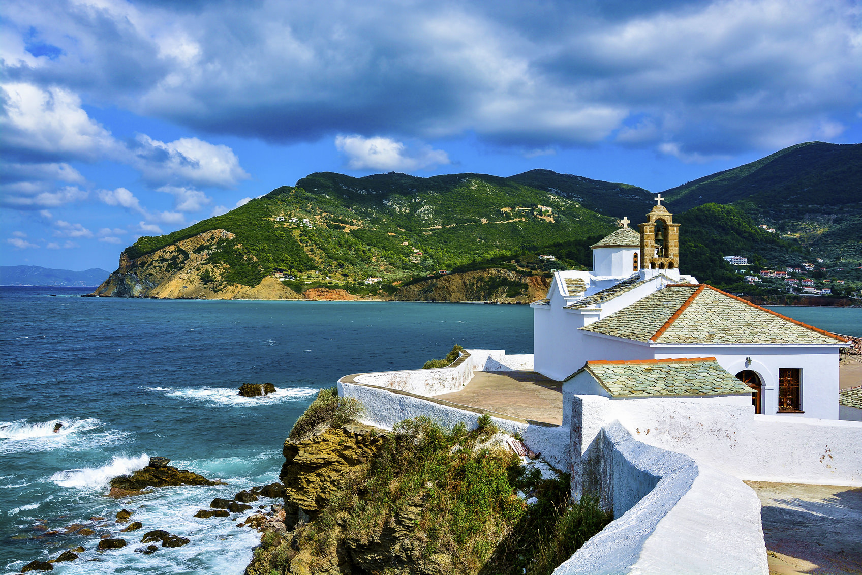 Beautiful view of Panagitsa Tou Pirgou church over the Skopelos bay on a windy summer day, Skopelos, Northern Sporades, Greece