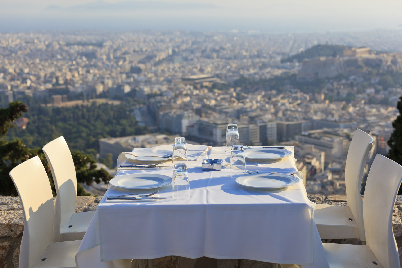 restaurant tables with panoramic view of athens town, lycabetus hill