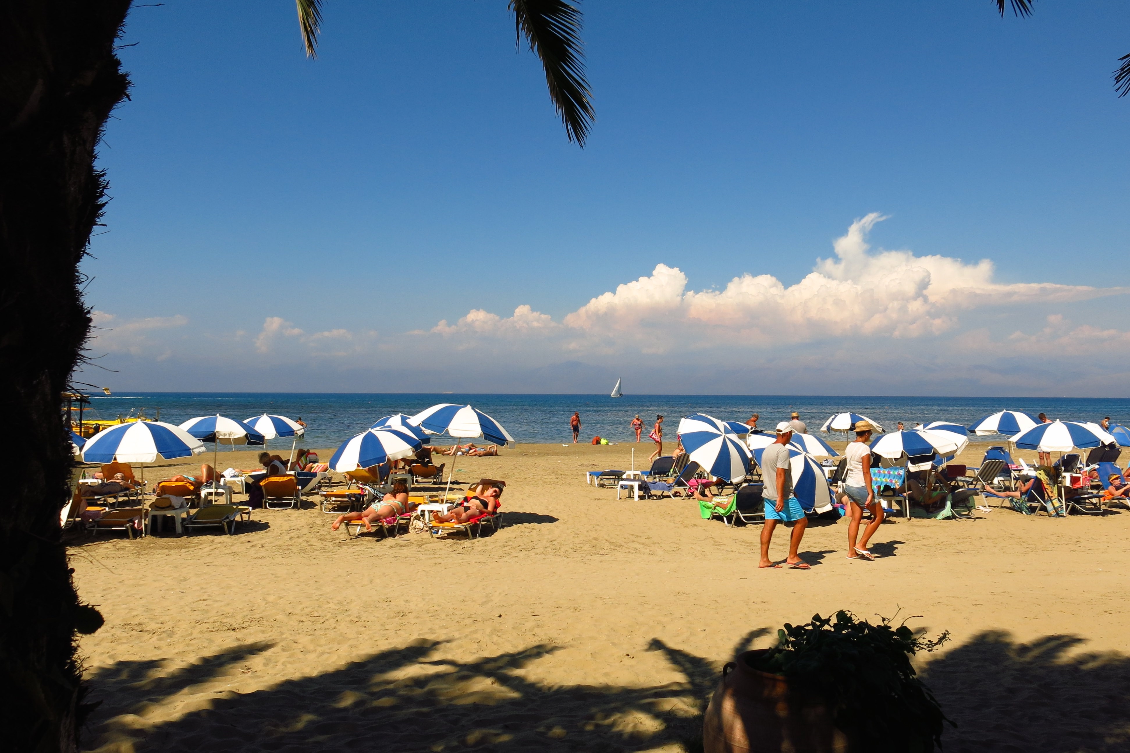 Corfu, Greece - August 31, 2014: Sunbathers relax on Sidari beach on the Greek island of Corfu.