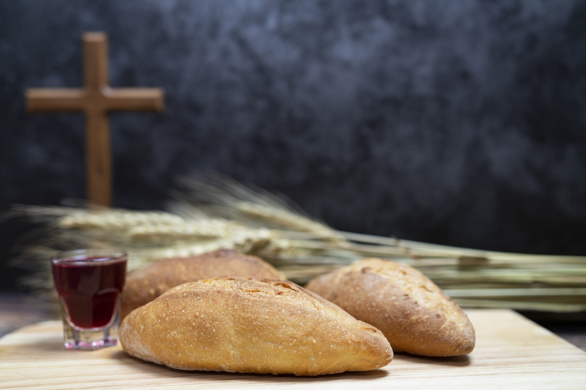 What do priests do when preparing Holy Communion?
